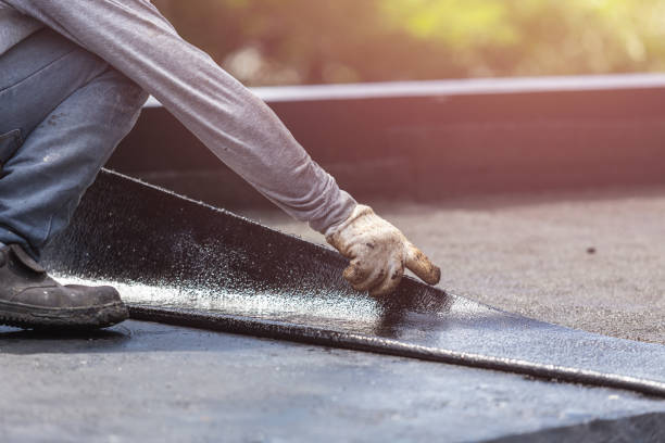 Professional Waterproofing technician working in Westwood, MI